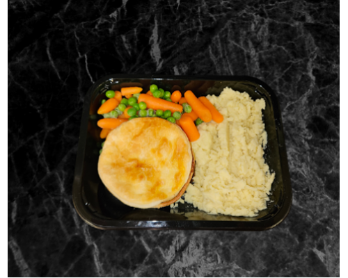 Home made individual steak pie, mashed potatoes, peas,carrots and gravy